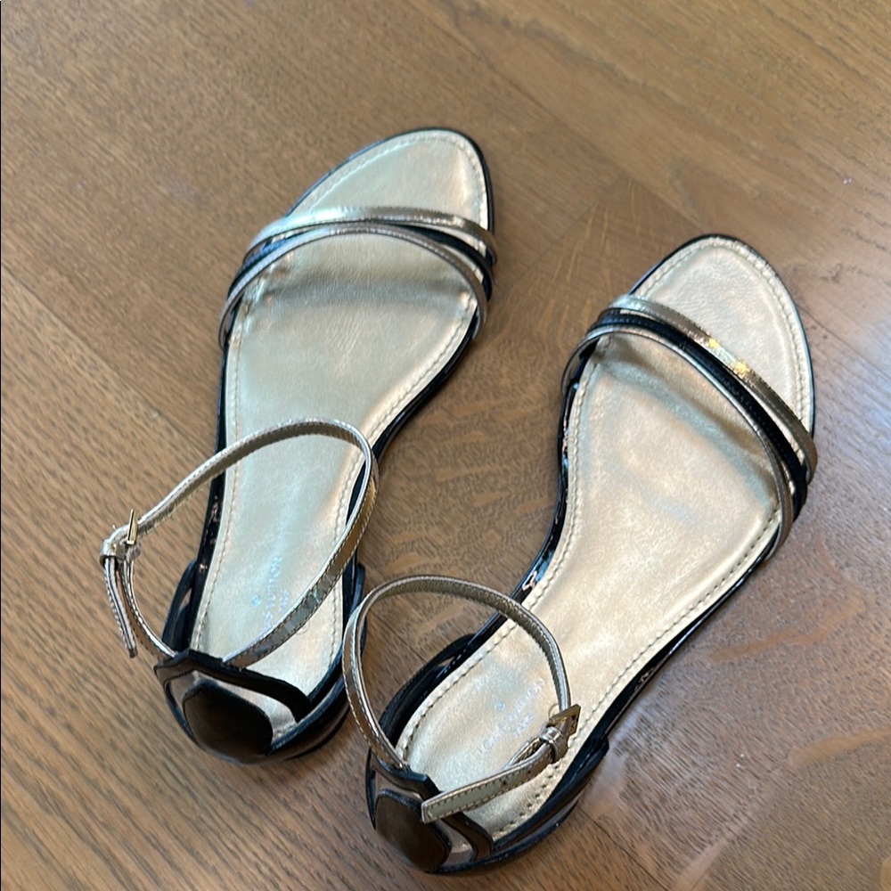 Louis Vuitton. NEW. Elegant Black and Gold Women's Sandals 38